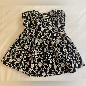 Black and white strapless, peplum top - size XS